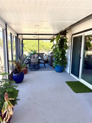 Sunroom / solarium featuring outdoor dining area