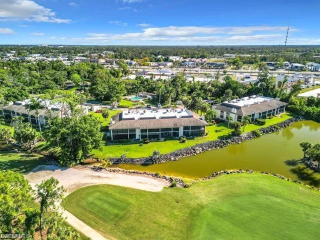 Drone / aerial view of a golf course and a large body of water