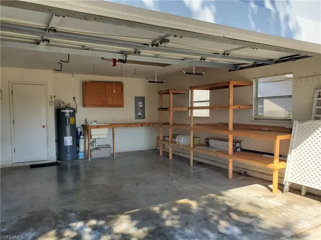 Garage with built-in shelves and utility sink