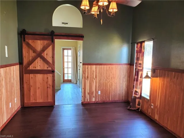 Primary bedroom leading to primary bathroom