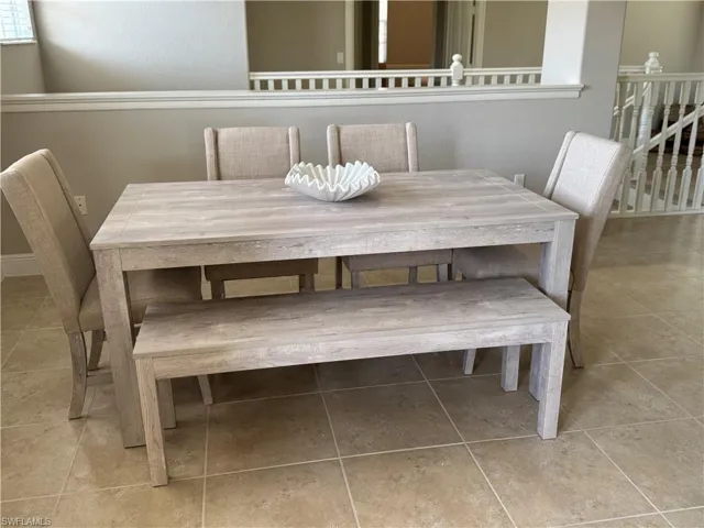Unfurnished dining area with tile patterned floors
