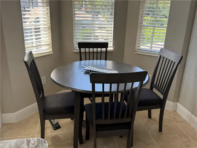 Tiled dining area with baseboards