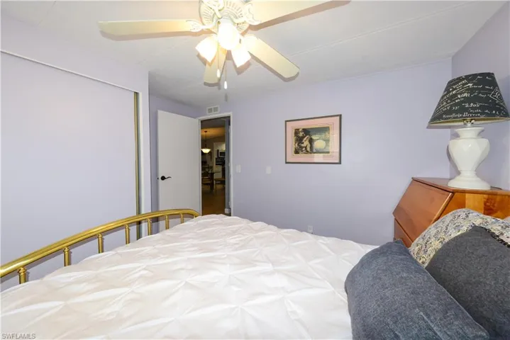 Bedroom featuring a ceiling fan and a closet