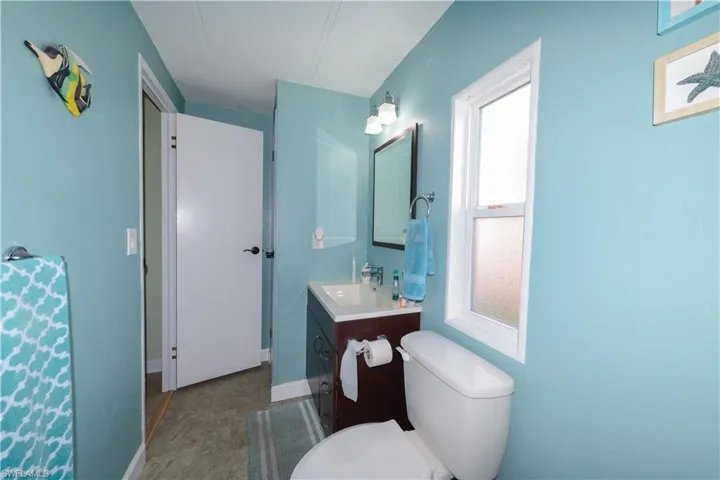 Full bathroom featuring vanity and toilet