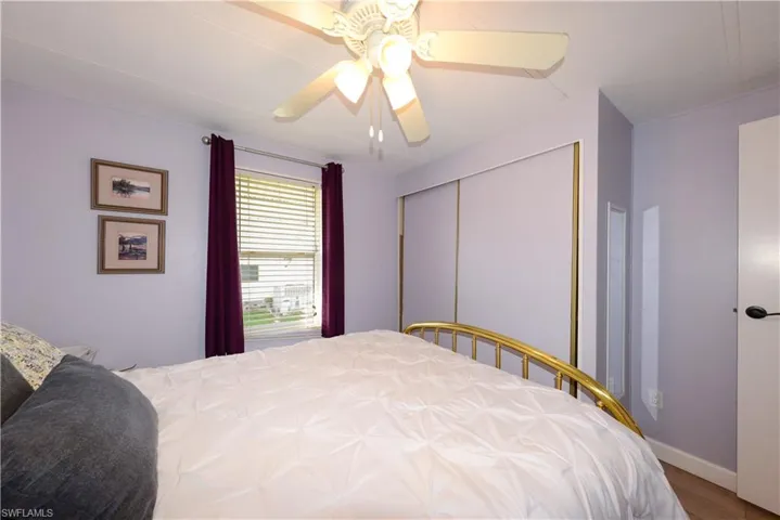 Bedroom featuring ceiling fan and wood finished floors