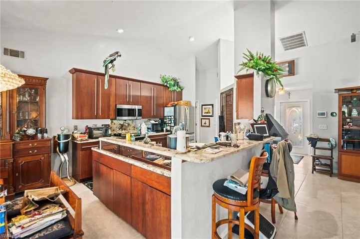 Plenty of storage in this kitchen with custom cherry cabinets with a corner style pantry