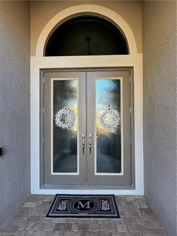 Hurricane impact resistant glass front doors