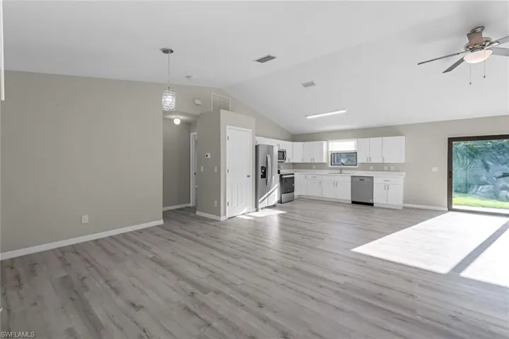 Open concept living with dining area to the left