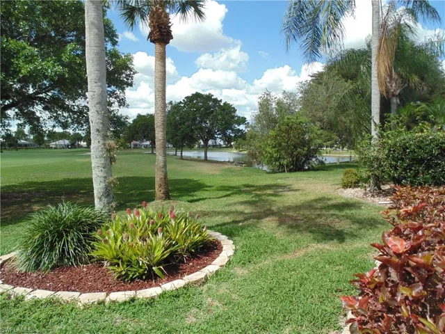 View of green lawn with a water view
