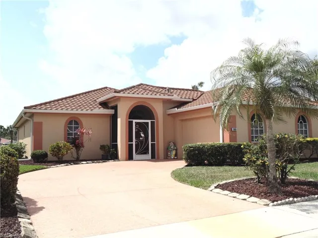 Mediterranean / spanish-style house featuring driveway, stucco siding, a garage, and a tiled roof