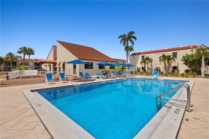 Community pool featuring a patio area