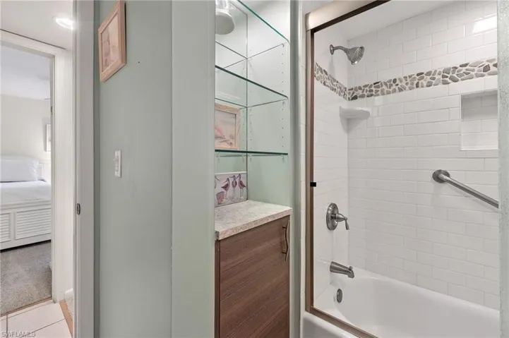 Bathroom featuring shower / tub combination and connected bathroom