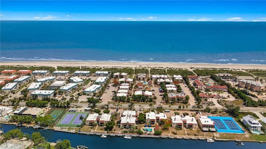 Drone / aerial view of waterfront with a beach