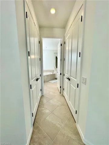 hallway with two sets of closet space
