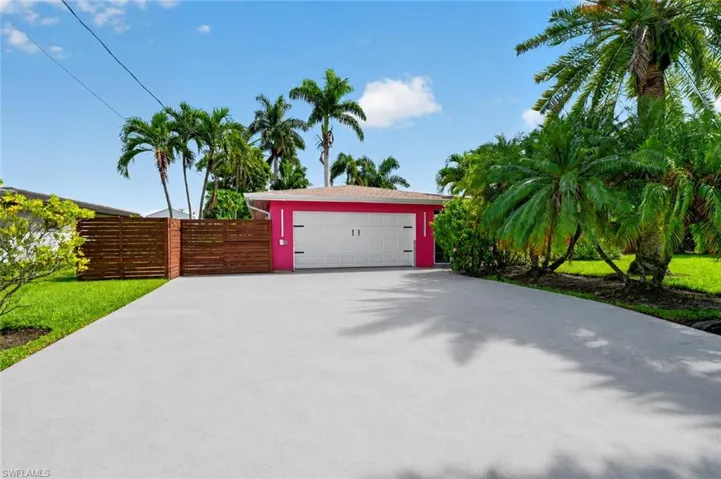 Front of home modestly conceals the amazing home and yard beyond, discretion and privacy abound.