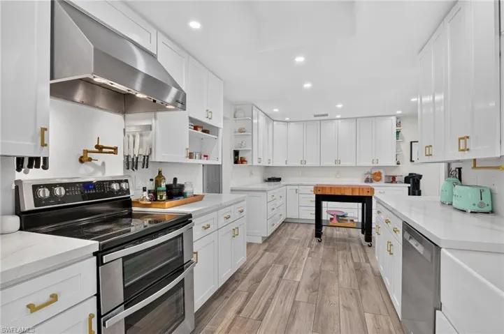 Large and updated chef's kitchen with quartz countertops.