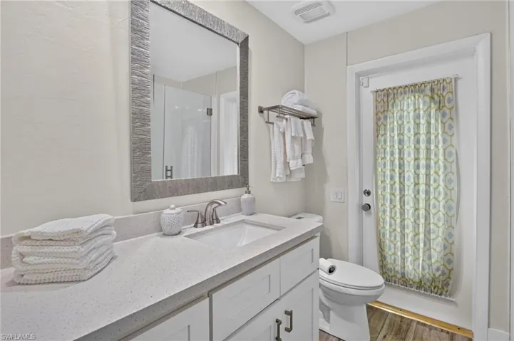Third full bathroom, door to pool area.