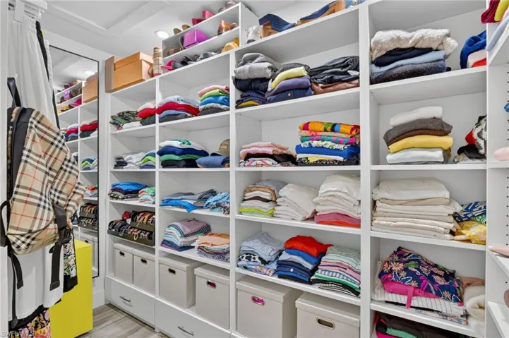 Custom shelving in walk-in closet off of primary bedroom.
