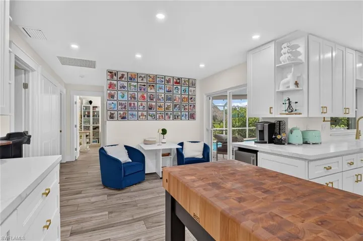 Informal eat in area with sliders to pool.