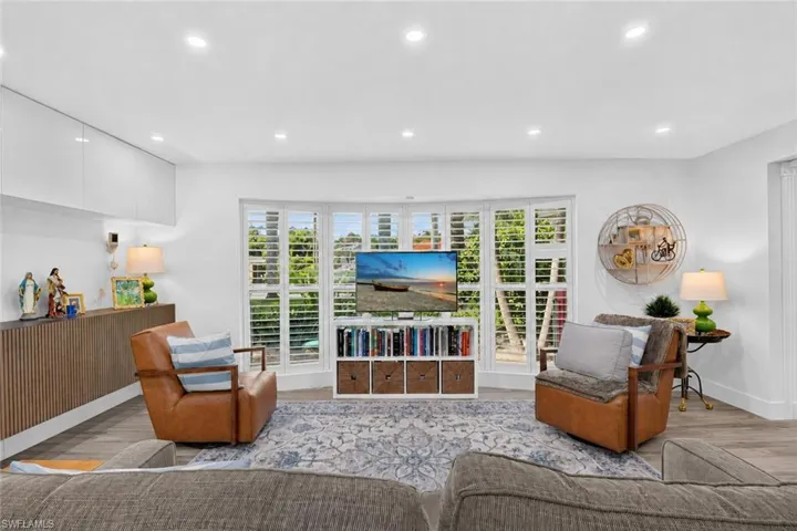 Plantation shutters complement the windows.
