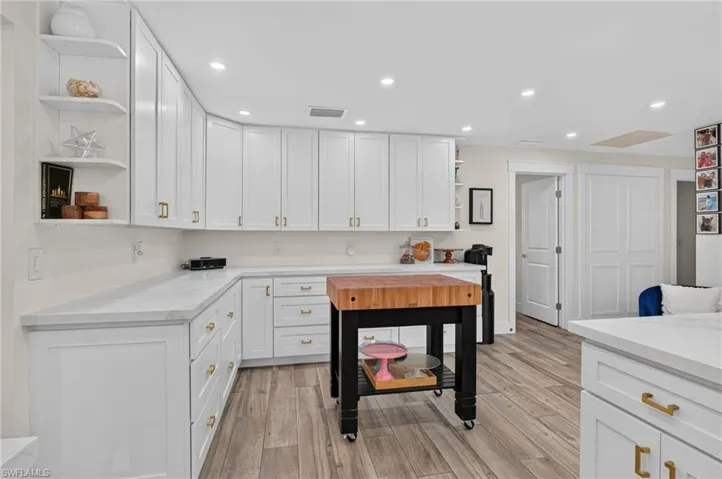 Extended kitchen area offers tons of food prep and storage space.