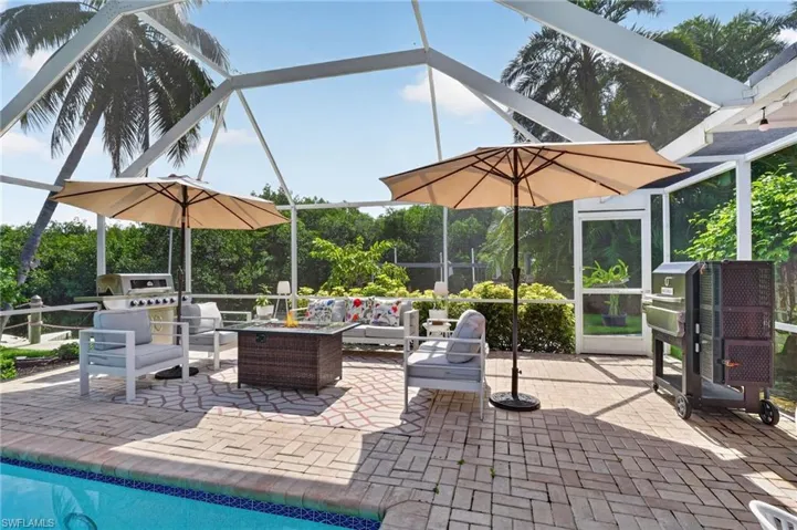 Pool area with fire pit, grill and smoker.