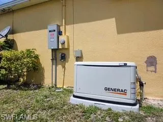 Generac brand stand-by generator system installed on a concrete pad