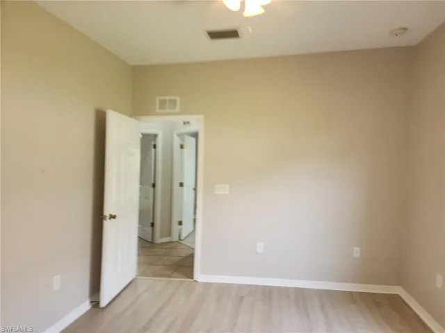 Neutral wall paint and wood-finish flooring