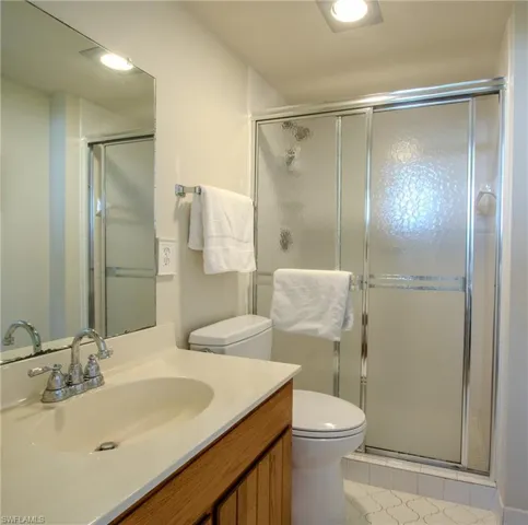 Full bathroom with walk in shower.