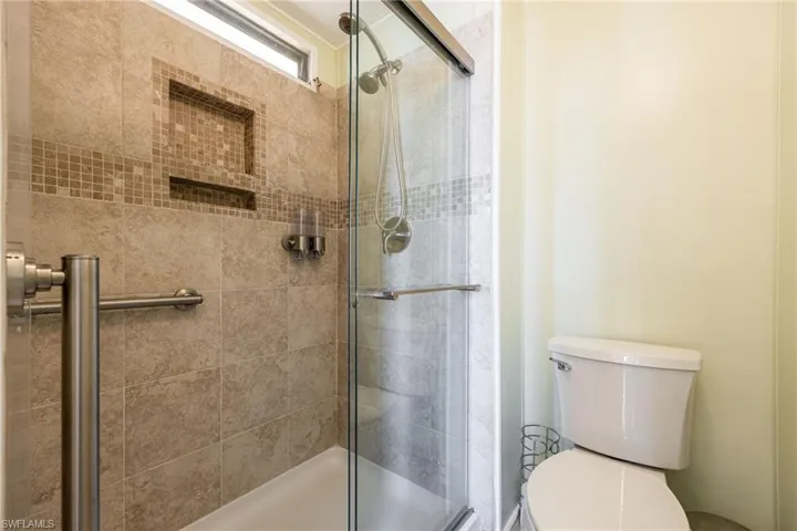 Bathroom with toilet and a shower stall