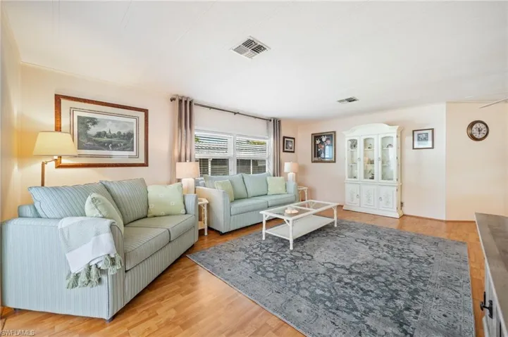 Living area with light wood-type flooring