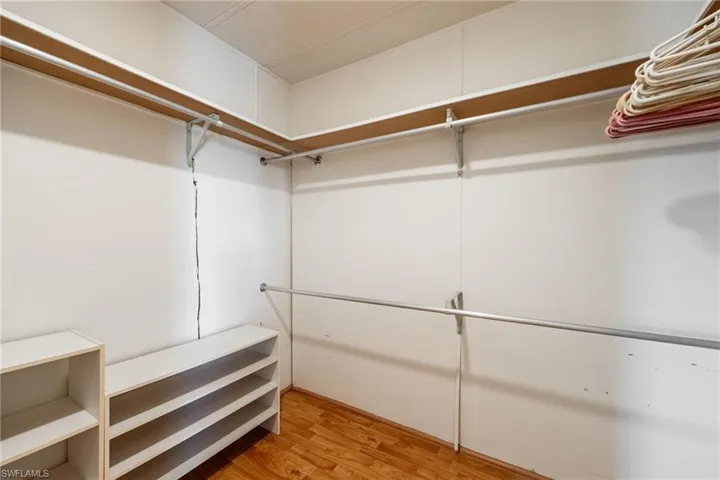 Walk in closet featuring light wood-style floors