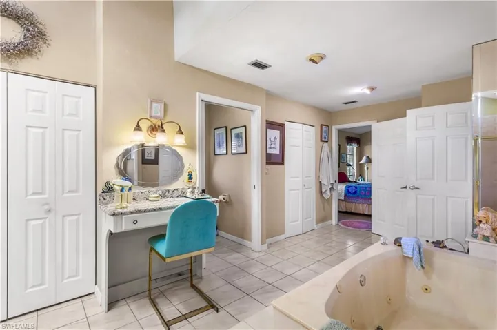Bathroom featuring tile floors and vanity