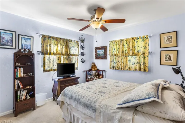 Bedroom featuring ceiling fan and carpet flooring
