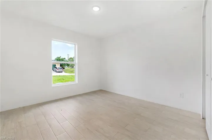 Empty room with light wood-type flooring