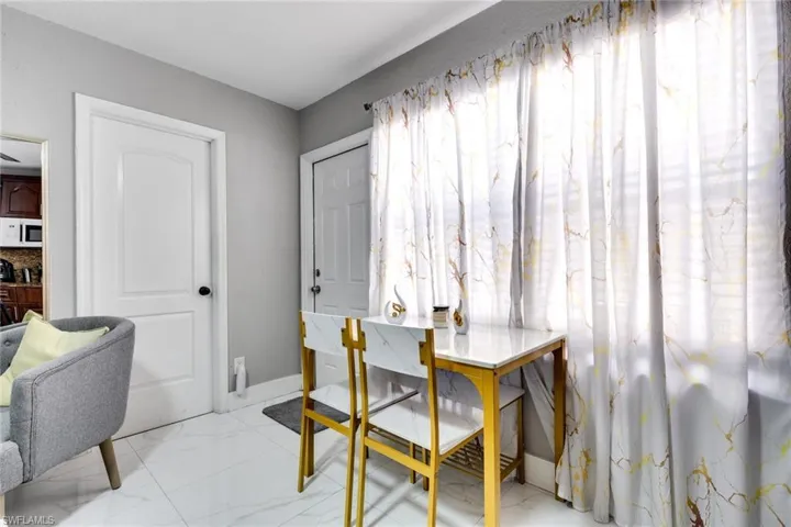 Dining room with marble finish floor