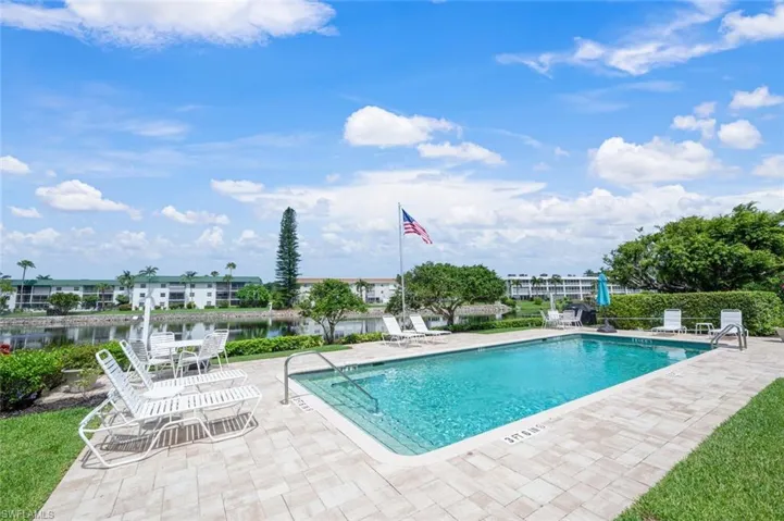 Community pool with a patio