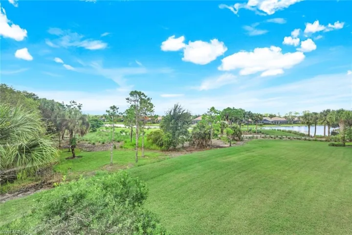 View of yard with a water view