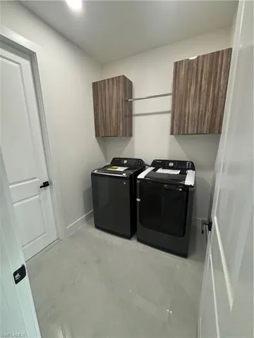 Washroom featuring washer and dryer