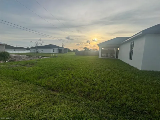 View of yard at dusk