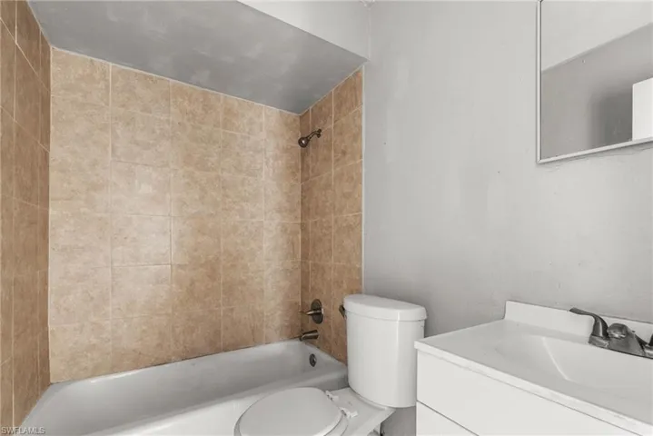 Bathroom featuring vanity and bathing tub / shower combination