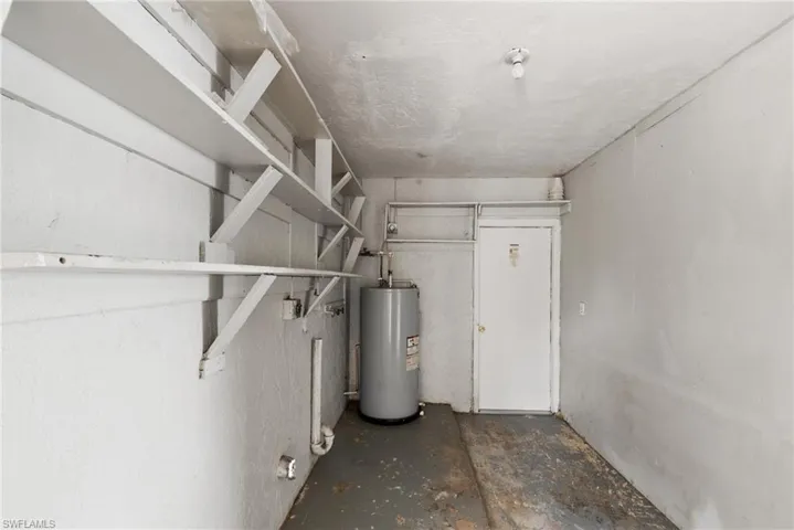 Utility room featuring water heater