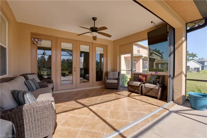 The covered lanai area has accordion hurricane shutters that slide and lock together.