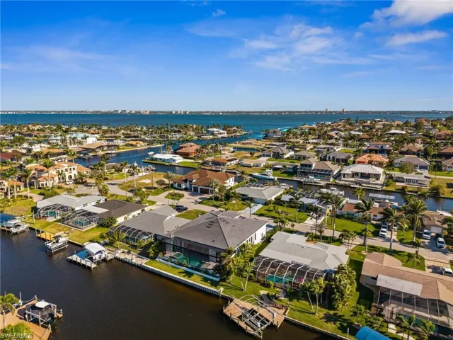 Aerial view featuring a water view and a residential view