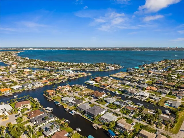 Drone / aerial view featuring a water view and a residential view