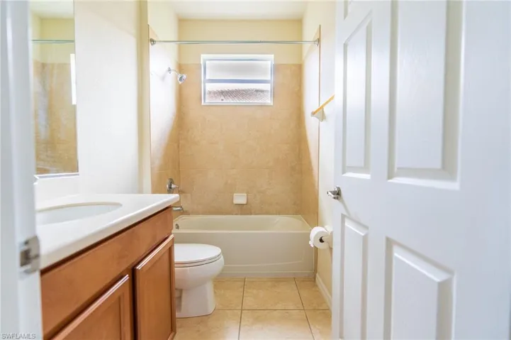 Unfurnished bedroom with light wood-style floors, a closet, and baseboards