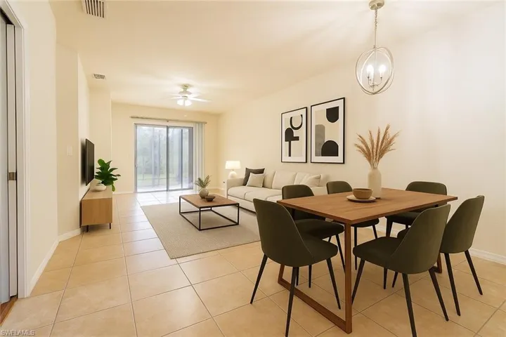 Kitchen with appliances with stainless steel finishes, a sink, brown cabinets, and light countertops
