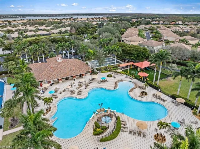 Community pool featuring a residential view and a patio