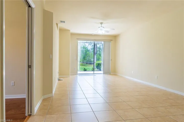 Unfurnished room featuring wood finished floors and baseboards
