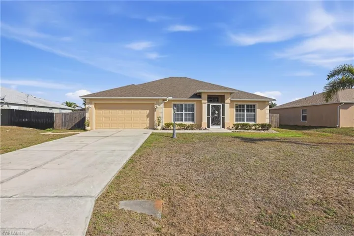 Ranch-style house with a garage, concrete driveway, stucco siding, and roof with shingles